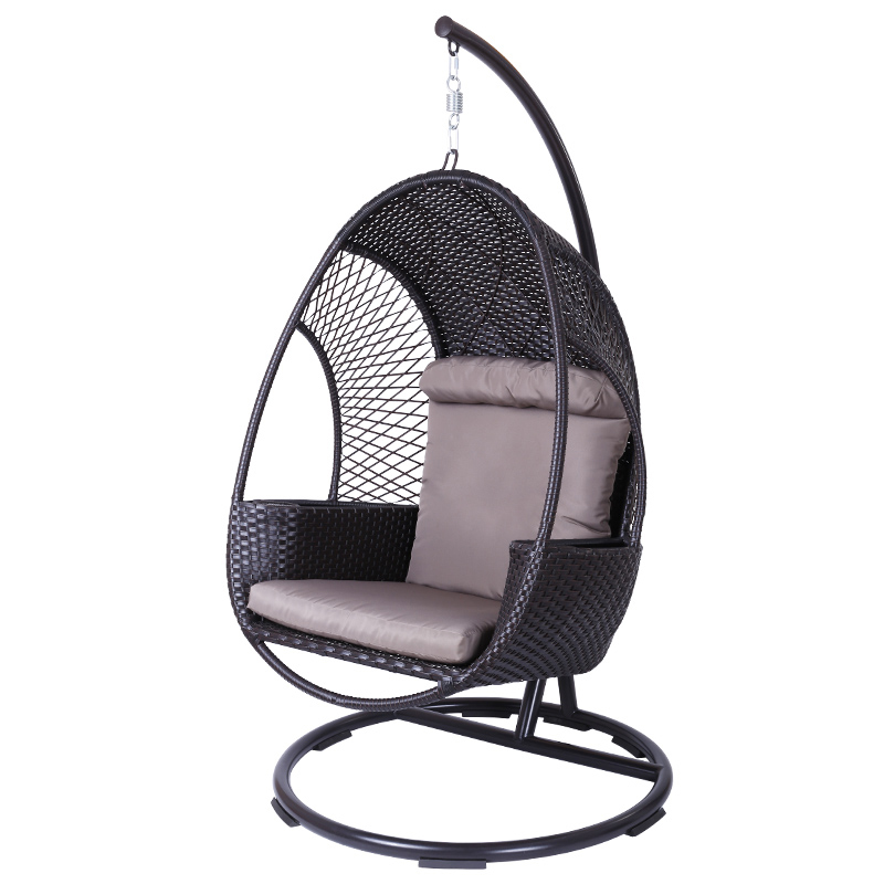 Rattan hanging chair in a garden setting