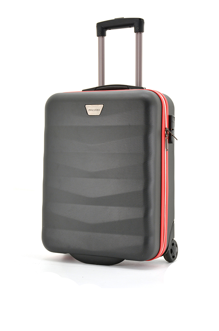 Hard shell suitcase detail showing corner and wheel housing