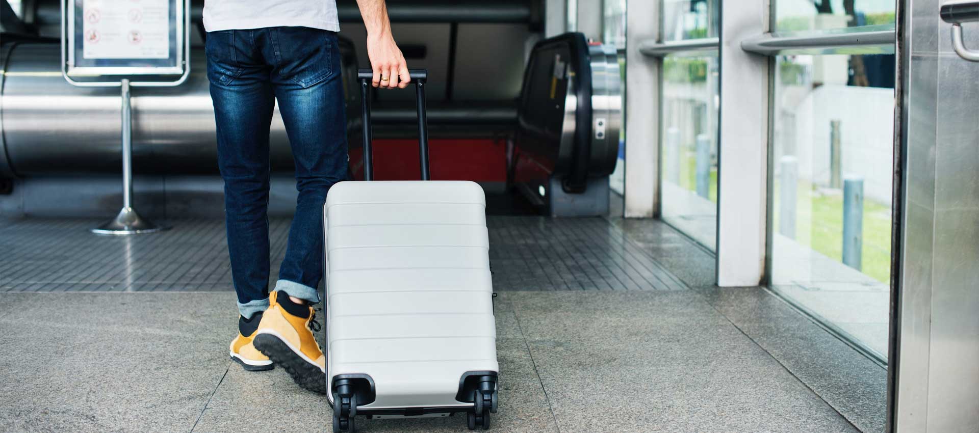 Hard shell luggage range photographed as a wide banner