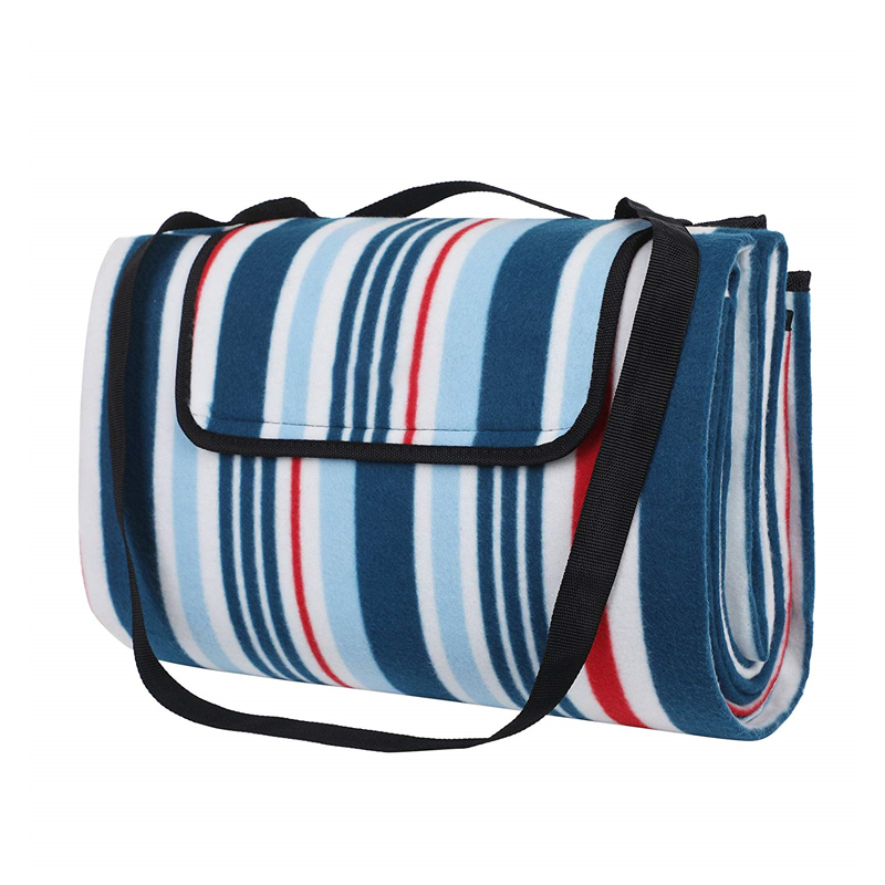 Folded picnic mat with carry handle